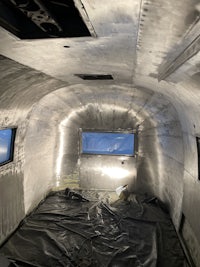 the inside of a metal building with a skylight
